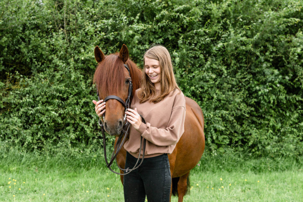 A chestnut mare pony and her owner