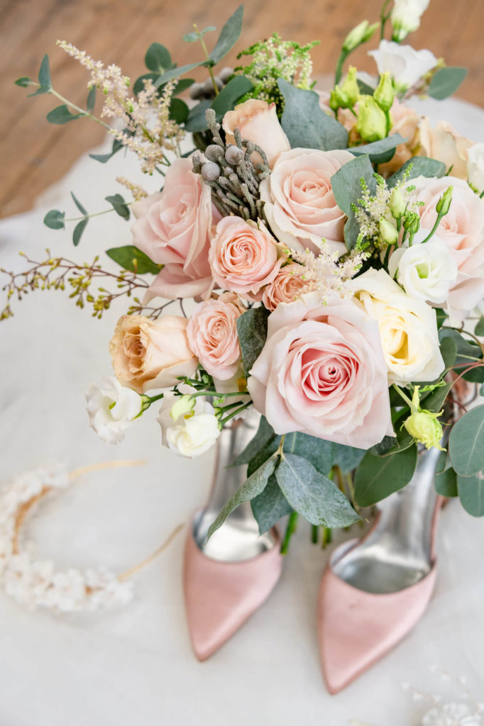 Elegant and feminine wedding details with pink roses