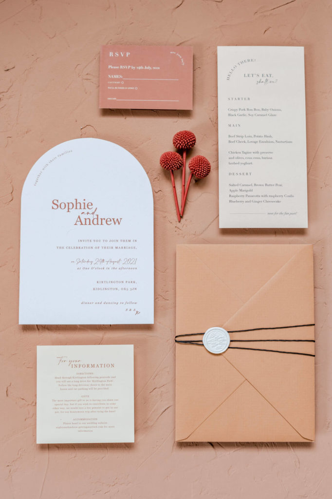 Chloe Bolam - Buckinghamshire Berkshire UK Wedding Photographer - wedding detail inspiration - terracotta and pink wedding stationery flatlay