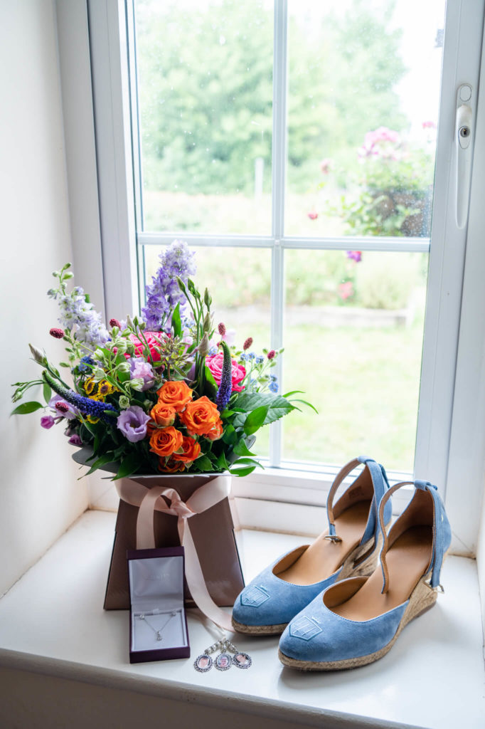 Chloe Bolam - Buckinghamshire Berkshire UK Wedding Photographer - wedding detail inspiration - blue fairfax and favor heels with a bright bouquet