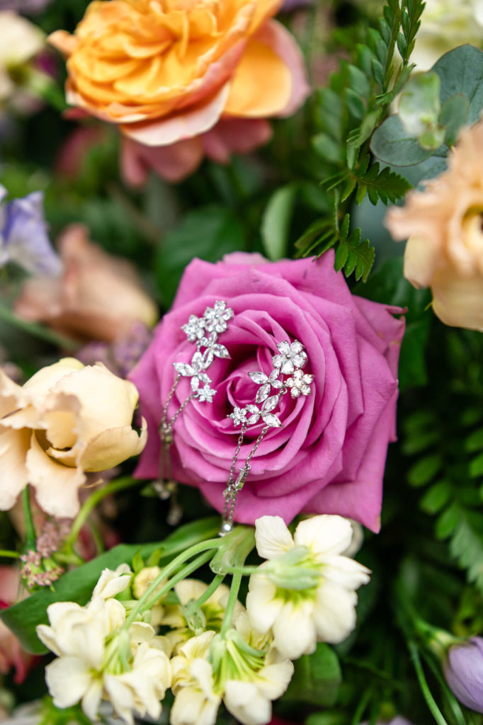 Chloe Bolam - Buckinghamshire Berkshire UK Wedding Photographer - wedding detail inspiration - pink summer wedding details - floral earrings on a pink rose