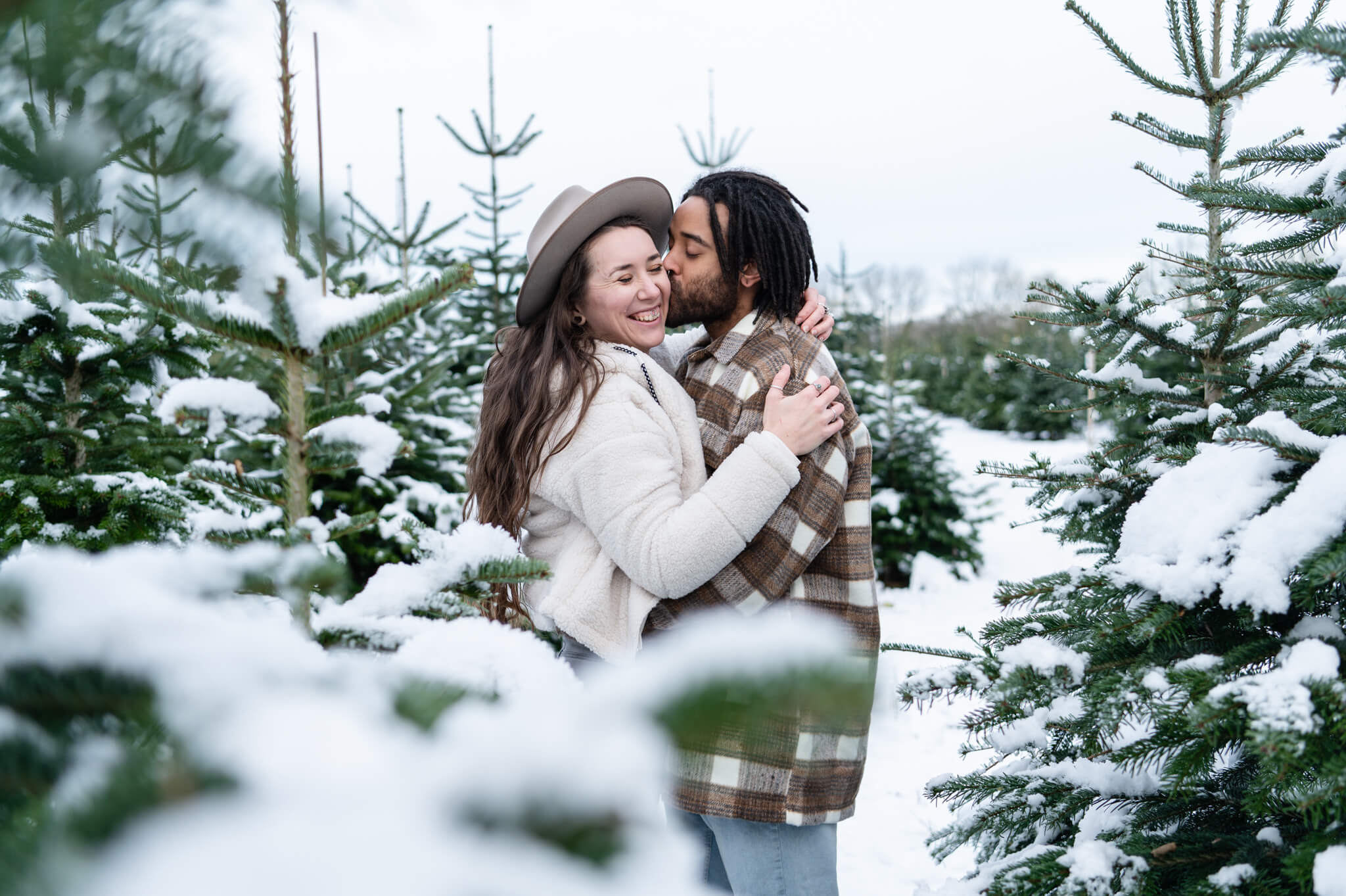 Chloe Bolam - Warwickshire Buckinghamshire Shropshire Couple, Engagement and Wedding Photographer - Fun winter snow couple photoshoot at a Christmas Tree Farm