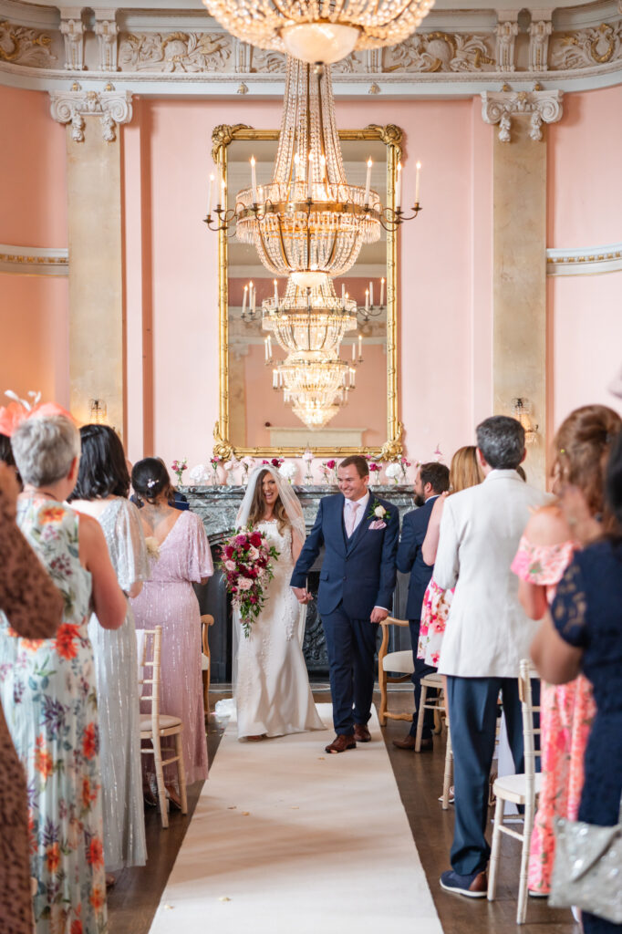 A couple during their wedding ceremony at their Danesfield House wedding