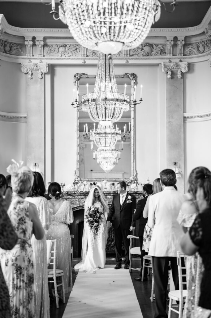 A couple during their wedding ceremony at their Danesfield House wedding