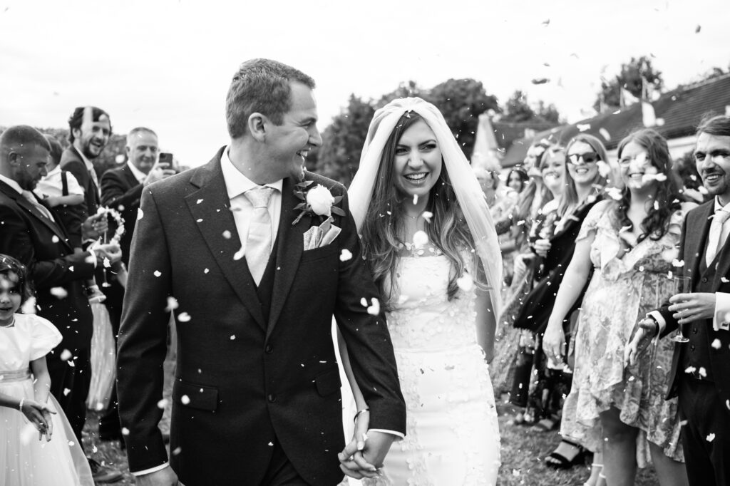 Black and white confetti photo. Shropshire & UK wedding photographer