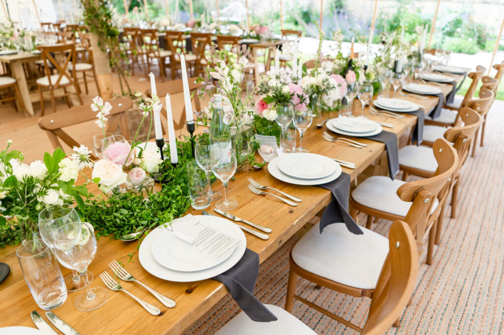 Wedding venue details and table set up layout. Outdoor marquee summer wedding