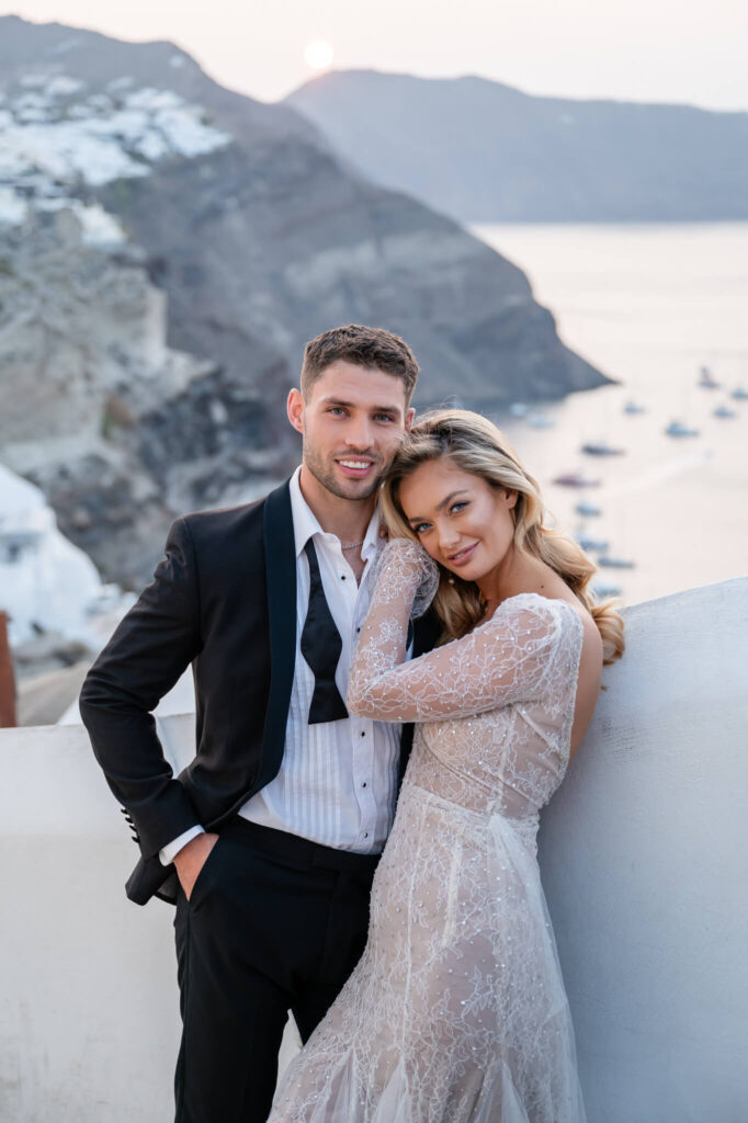 Couple portraits during a destination wedding in Europe with the sea as a backdrop