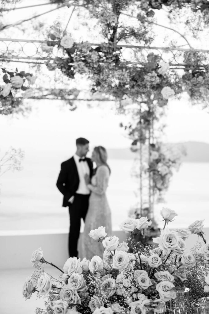 Couple portraits during a destination wedding in Europe with the sea as a backdrop