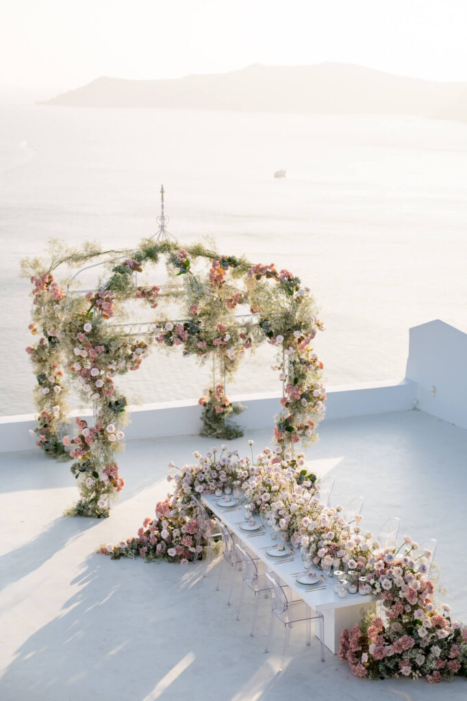 A destination wedding in Europe with floral styling and the sea as a backdrop