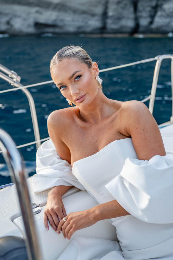 Bridal portraits during a destination wedding in Europe with the sea as a backdrop