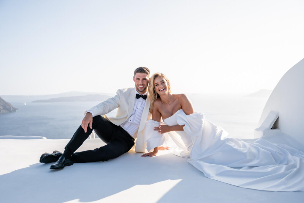 Couple portraits during a destination wedding in Europe with the sea as a backdrop