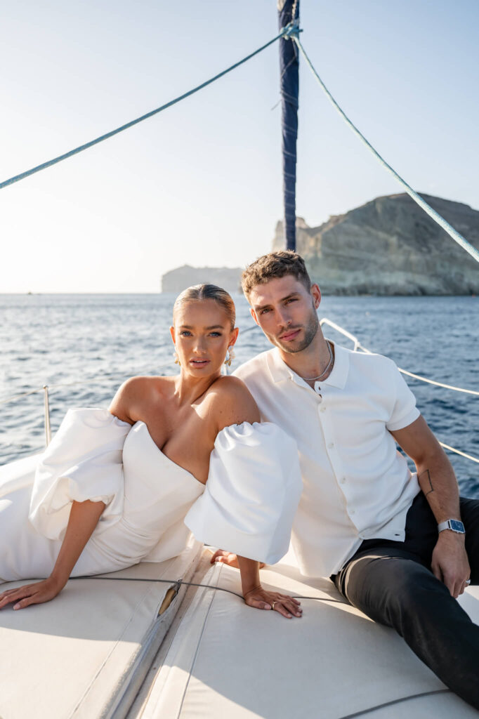 Couple portraits during a destination wedding in Europe on a boat trip with the sea as a backdrop