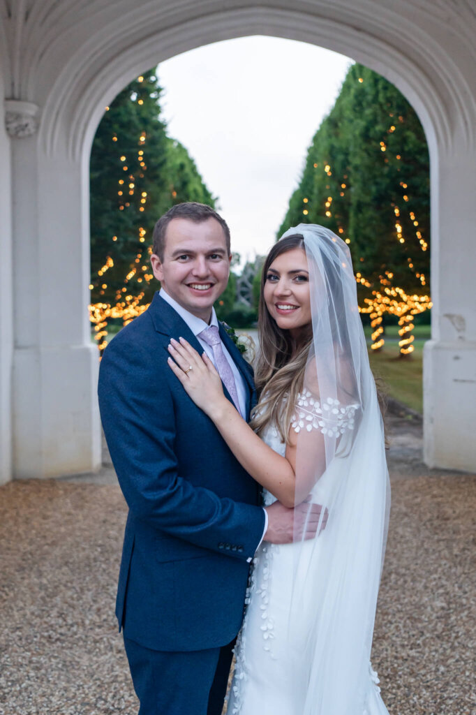 Evening couple portraits with fairylights at Danesfield House