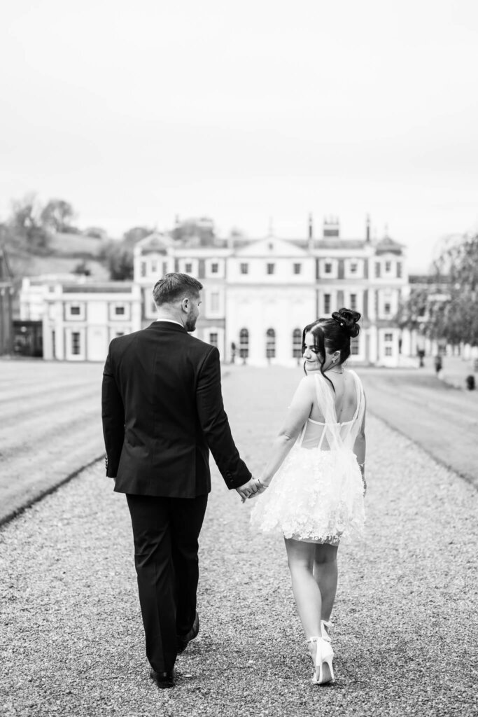 Hawkstone Hall Wedding Photographer Chloe Bolam Photography. A couple wearing a black tie suit and a bridal mini dress