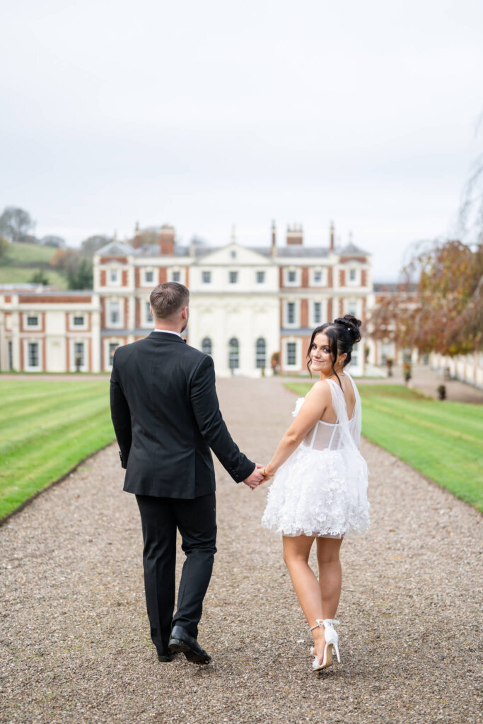 Hawkstone Hall Wedding Photographer Chloe Bolam Photography. A couple wearing a black tie suit and a bridal mini dress