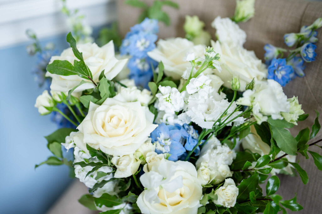 Beautiful white and blue wedding bouquet at Stowe House