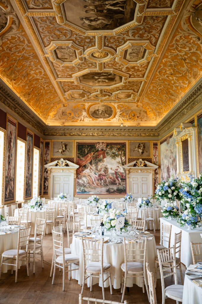 The State Dining Room at Stowe House. Luxury wedding breakfast with blue and white flowers