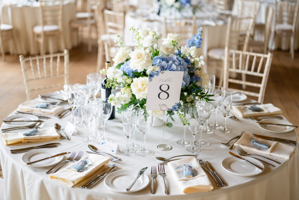 Stowe House wedding round table setting with blue and white florals